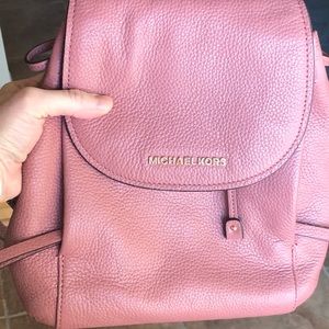 Michael Kors “Riley” rose colored backpack